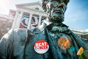 Beat Cancer button on Abe Lincoln statue on Bascom Hill